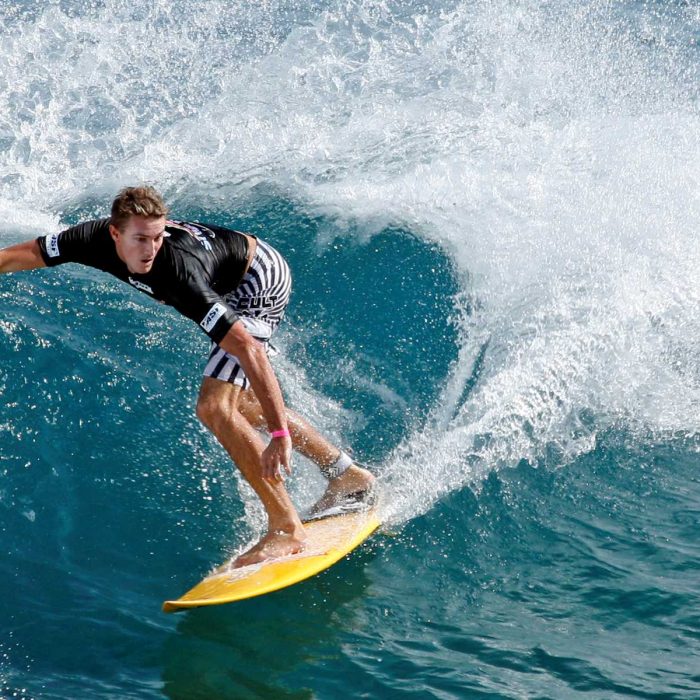 A man surfing in a wave